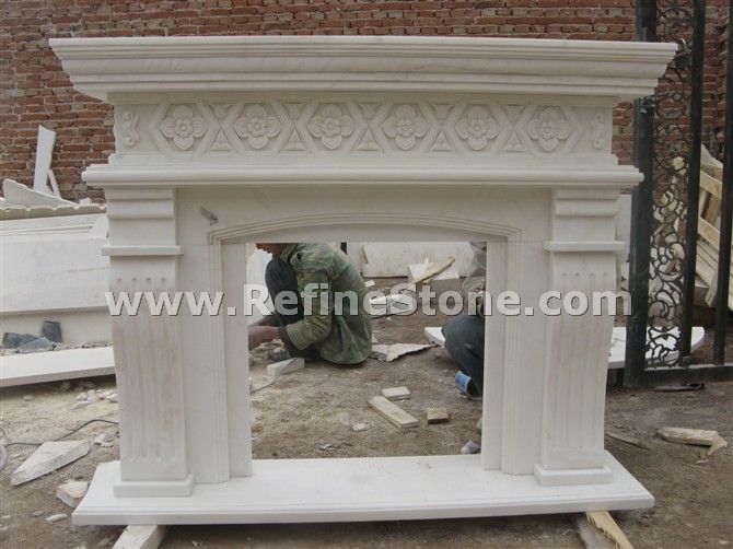 Marble fireplace with carved