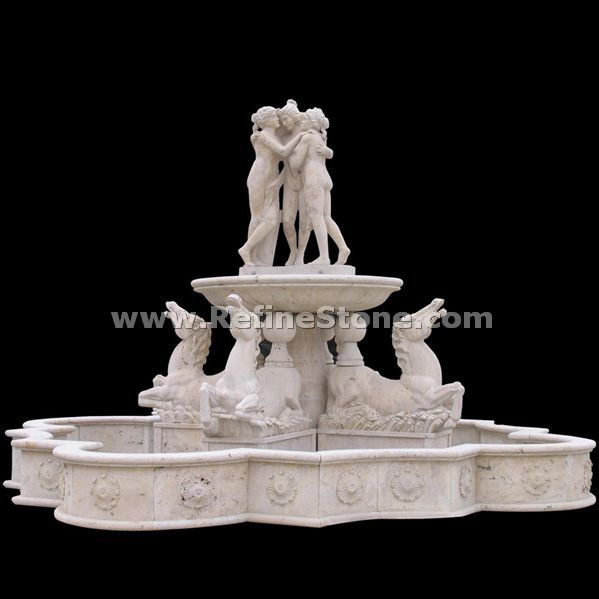carved human and animal water fountain