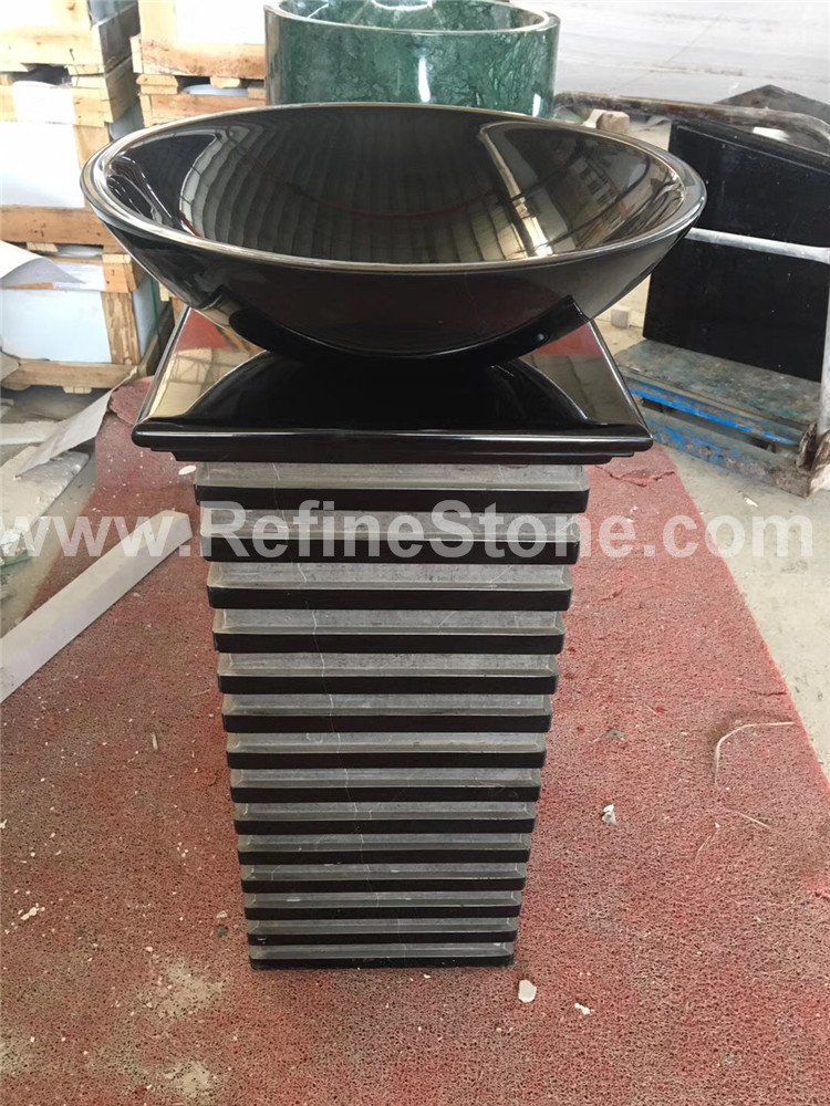 Black marble pedestal sink